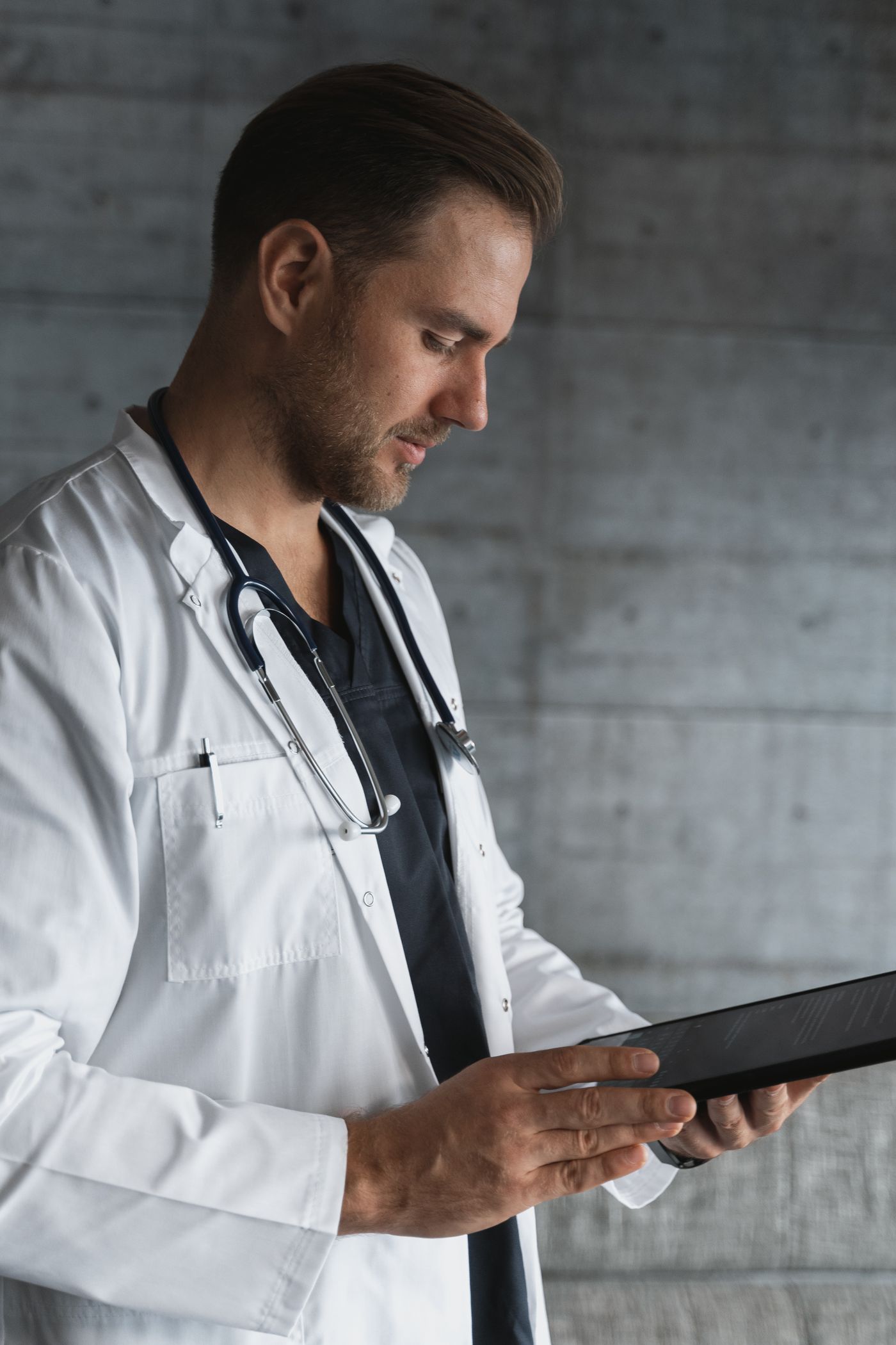 Clinician reviewing patient information on a tablet